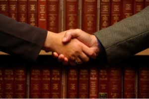 attorney shaking hands with client